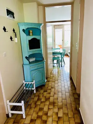 a room with a blue cabinet and a table at Relax in nature Apartment in Bovec
