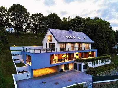an aerial view of a house with lights at Vila Katarina - Lake View Apartments in Bled