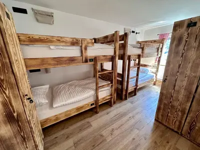 a group of bunk beds in a room at Bajta Kroparica in Kropa