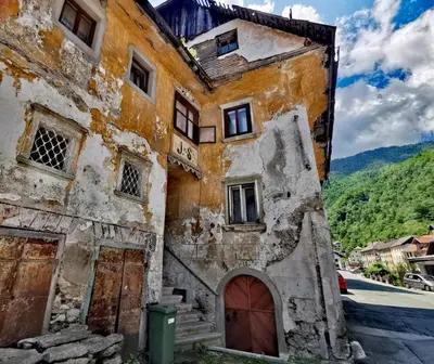 an old building on the side of a street at Bajta Kroparica in Kropa