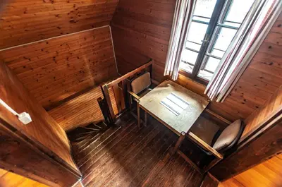 an overhead view of a dining room with a table and chairs at Mala koča Wooden Cabin in Goreljek