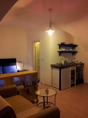 a living room with a couch and a table at Studio Ian in Ljubljana