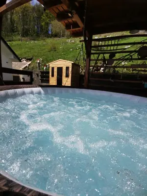 a large swimming pool with blue water in it at Apartma na KOZOLCU in Dobovec