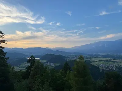 a view of a valley with mountains and trees at Koča na Taležu in Bled