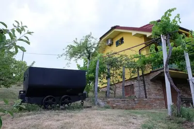a black truck parked in front of a house at Vikend hiša Vrhe in Senovo