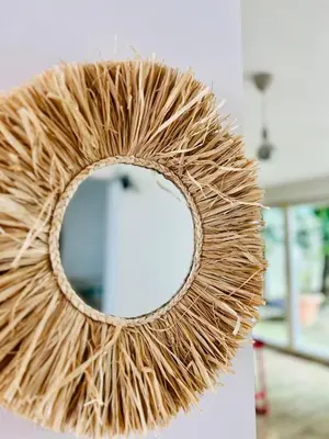 aisal wreath with a mirror on a wall at Sunny app in Ljubljana