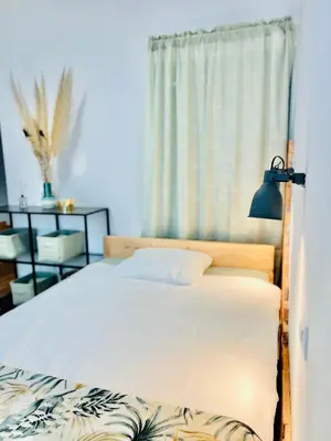 a bedroom with a bed and a window at Sunny app in Ljubljana