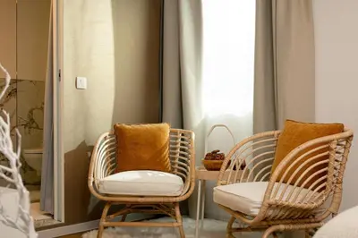 two chairs and a table in a room with a window at New Cute Studioapartment in Ljubljana + Free bikes in Ljubljana