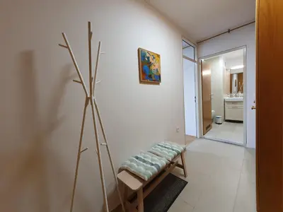 a living room with a bench and a bathroom at Apartment Zala with free parking Tour As Ljubljana in Ljubljana