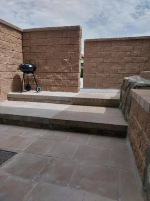a grill sitting on the side of a brick wall at Apartment Neli in Rečica ob Savinji