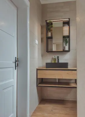a bathroom with a sink and a mirror at Pirc apartment on Dunajska street in Ljubljana