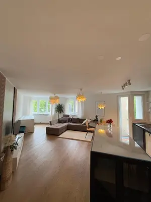 a large living room with a couch and a table at Luxury Residence Res in Ljubljana