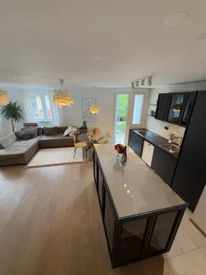 a living room with a couch and a table at Luxury Residence Res in Ljubljana