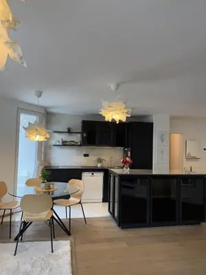 a kitchen with a table and chairs in a room at Luxury Residence Res in Ljubljana
