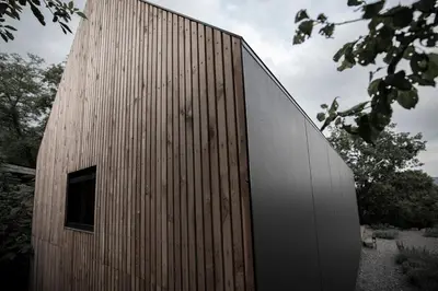 a wooden building with a window on the side of it at Moon - Tiny house from Callin Wines in Sežana