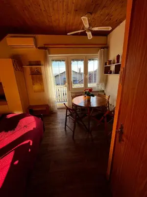 a living room with a table and a couch at Mekina Guesthouse in Maribor