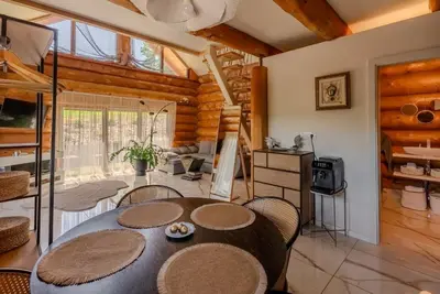 a dining room with a table and some chairs at Chalet -VV in Podčetrtek