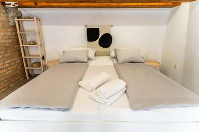 a room with two beds and two pillows at The Wonderful Loft in Ljubljana