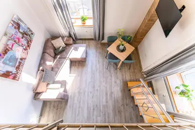 an overhead view of a living room with a couch and a table at The Wonderful Loft in Ljubljana