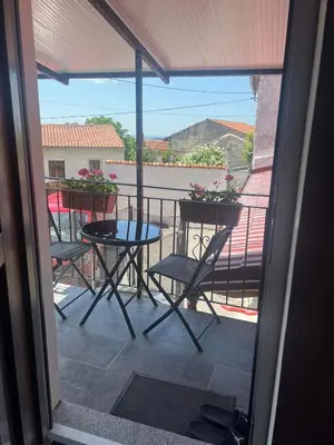 a view of a balcony with a table and chairs at Apartma Mia in Črni Kal