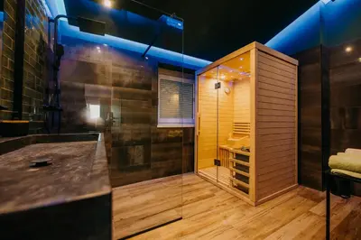 a large bathroom with a shower and a tub at Villa Sunset Pool & Spa apartments in Zgornje Škofije