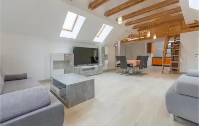 a living room with a couch and a tv at 1 Bedroom Stunning Apartment In Col in Zoll
