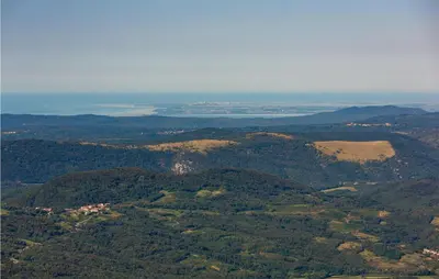 an aerial view of a mountain with trees and water at 1 Bedroom Nice Apartment In Col in Zoll