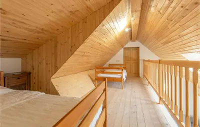 a room with a bed and a wooden ceiling at 1 Bedroom Nice Apartment In Col in Zoll
