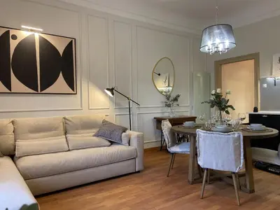 a living room with a couch and a table at Apartment Breg - Old town river in Ljubljana