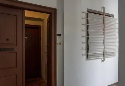 a room with a hallway with a window with white towels at Apartment Breg - Old town river in Ljubljana