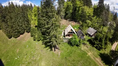 an aerial view of a house on a hill with trees at OTO`S CABIN in Radovljica