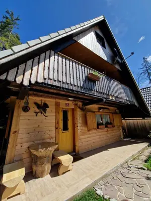 a wooden cabin with a wooden floor and a roof at OTO`S CABIN in Radovljica