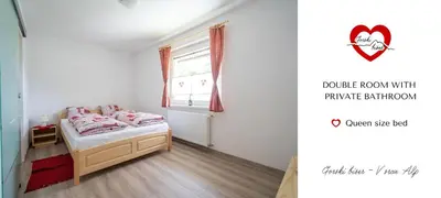 a small bedroom with a bed and a window at Gorski biser in Mojstrana