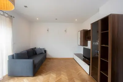 a living room with a couch and a tv at Apartment Rozalija Žirovnica in Žirovnica