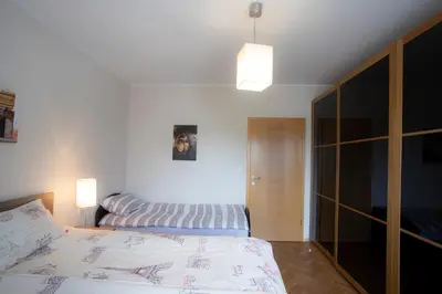 a bedroom with a bed and a bed at Apartment Rozalija Žirovnica in Žirovnica
