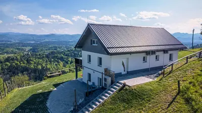 a house on a hill with a view at Apartmaji Gračner in Dramlje