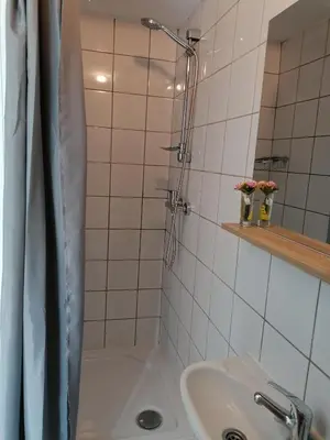 a bathroom with a shower and a sink at Pri stari preši in Lendava