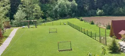 a field with two goal nets in the grass at GREEN LAND Family Fun Sport Resort in Šmarje pri Jelšah