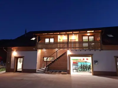 a building with a staircase on the side of it at GREEN LAND Family Fun Sport Resort in Šmarje pri Jelšah