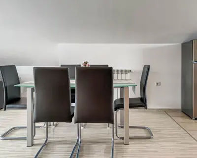 a conference room with a table and chairs at Apartma Hilltop Haven in Šmarje pri Jelšah