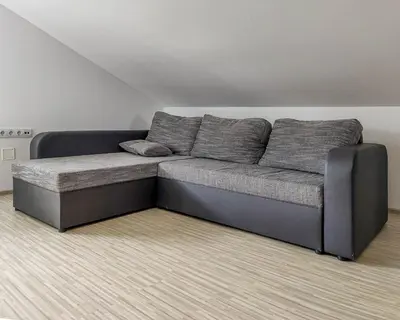 a gray couch in a room with at Apartma Hilltop Haven in Šmarje pri Jelšah