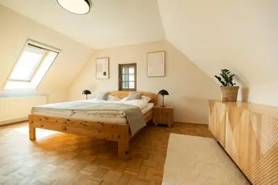 a bedroom with a bed and a window at An der Südsteirischen Weinstraße Gamlitz - Idyllisches Ferienhäuschen im Naturparadies mit großem Whirlpool & Panoramasauna in Zgornja Kungota