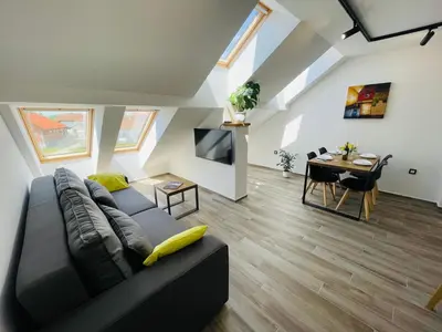 a living room with a couch and a table at Vacation Station Ptuj in Videm pri Ptuju
