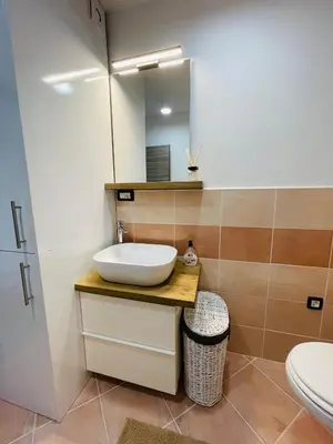 a bathroom with a sink and a mirror at Vacation Station Ptuj in Videm pri Ptuju
