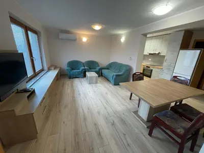 a living room with a couch and a table at Apartma Ivana in Markovci
