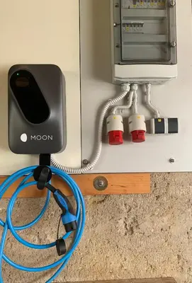 a blue hose is hooked up to a microwave at Apartma Ivana in Markovci