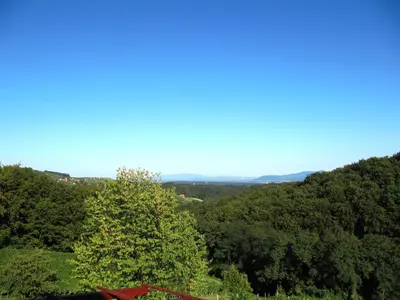 a view of a valley with trees and a blue sky at Holiday Home Češnovar in Raka