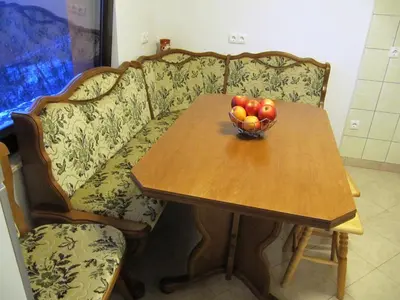 a table with a bowl of fruit on a couch at Holiday Home Češnovar in Raka