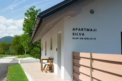 a building with a sign on the side of it at APARTMAJI SILVA in Slappe dʼIdria