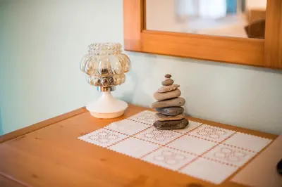 a stack of three rocks sitting on top of a table at Bed & Breakfast Hisa Resje in Bohinj